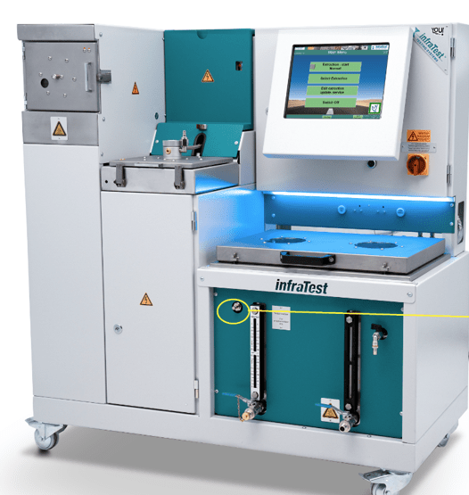 A laboratory testing machine with a touchscreen display, labeled "infraTest," features controls, buttons, and warning signs, in a clean, modern design.