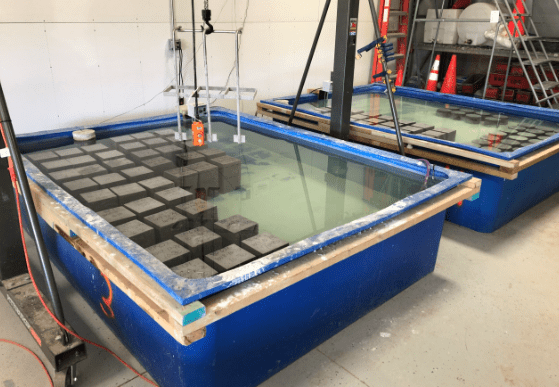 Concrete materials testing setup with water tank for durability testing